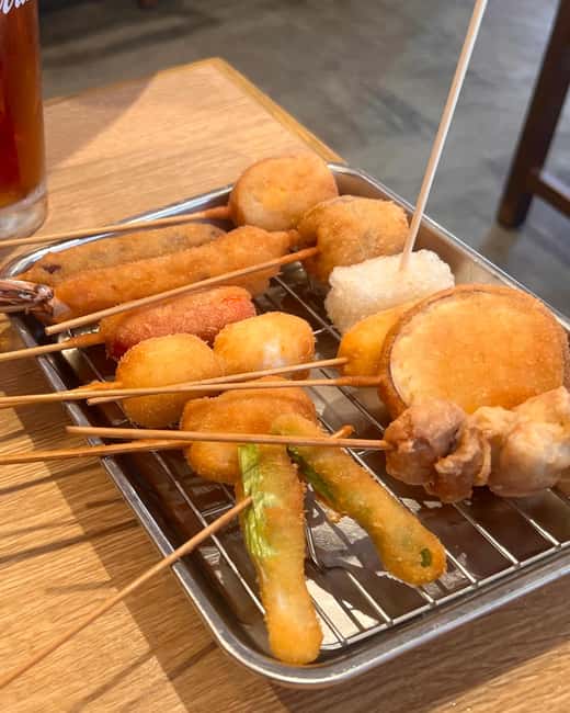3.5h Osaka Night guided Local Bar Hopping, Sake & Karaoke - Hozenji Temple brings the volume down