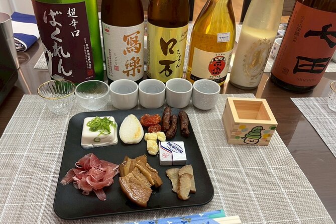Japanese Sake Tasting and Masu Crafting Experience in Tokyo - Tasting sake in a small Ikebukuro room