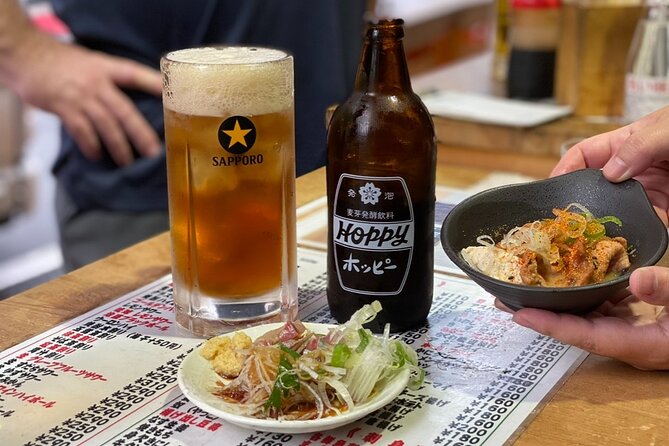 Private Tokyo Food Tour - Retro Akabane Izakaya Experience - Third stop: a seafood grill and local izakaya